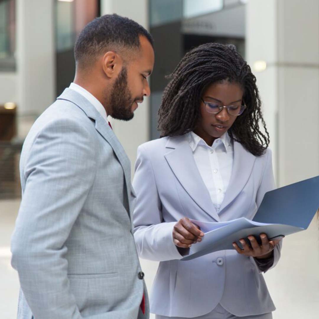 Man aside and a lady holding papers